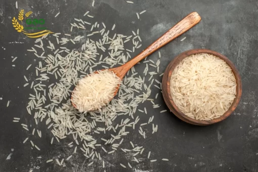 Long grain rice in the spoon and bowl